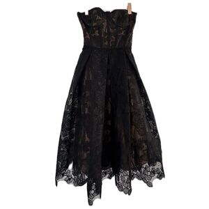 Olivia Strapless Lace Dress
NADINE MERABI